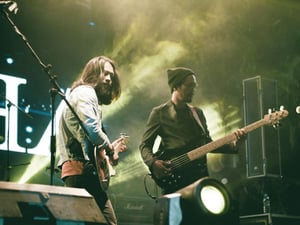 Two band members at a concert